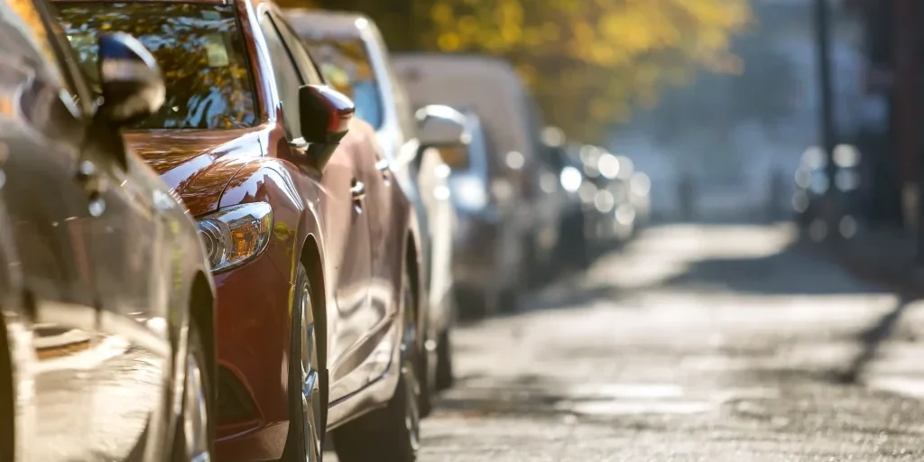 long-row-of-different-shiny-cars-and-vans-parked-a-2024-12-06-11-16-49-utc
